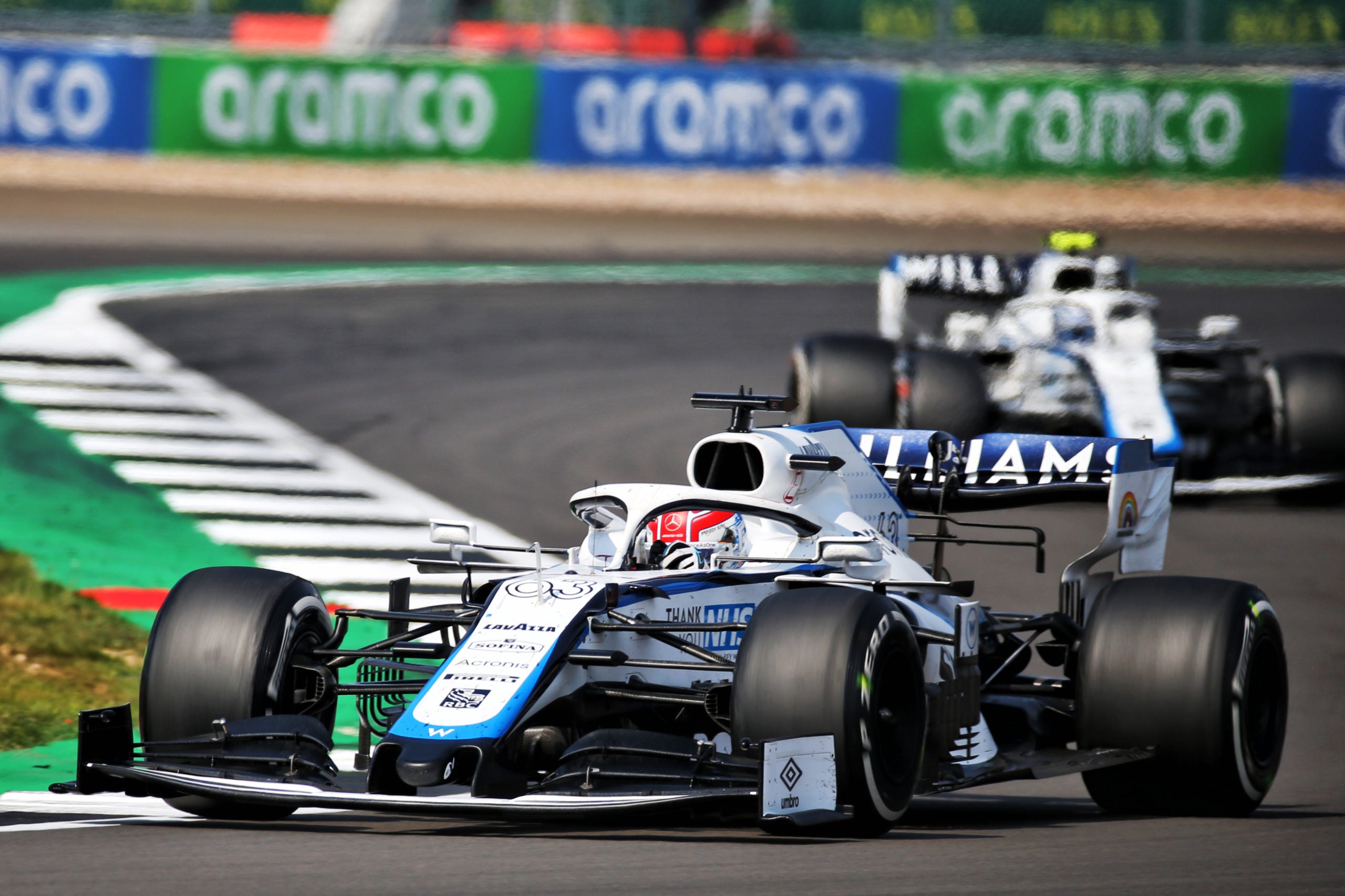 Williams F1 cars navigating through a corner